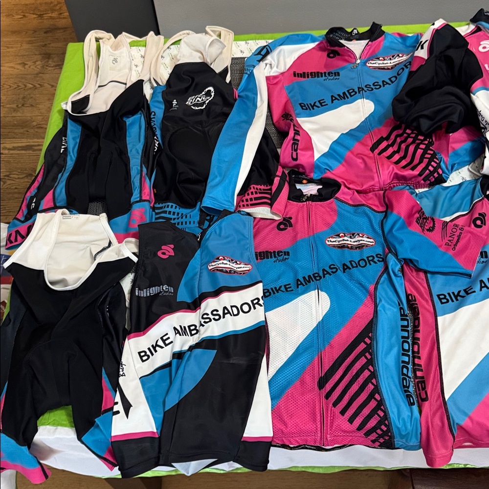 Champion Women's Pink, Black & Light Blue Cycling kits.
